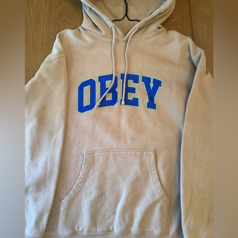 Obey Beige Hoodie with Blue Lettering